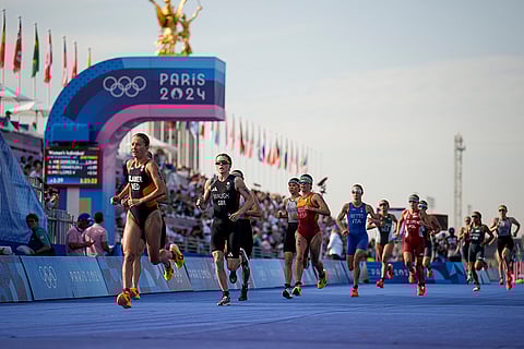 Kate Waugh competes during the women's individual triathlon